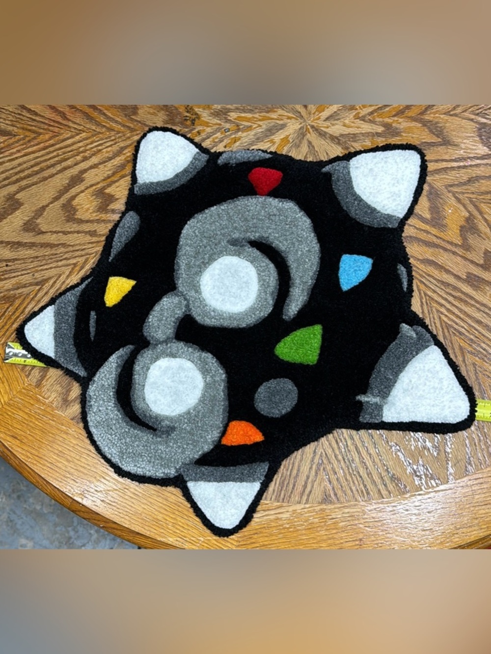 This rug is a handmade representation of a shiny
Minior from Pokémon